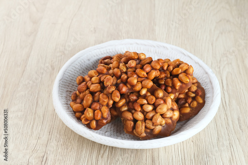 Ampyang Kacang or Gula Kacang, Indonesian traditional snack, made from peanuts and brown sugar. The taste of this snack is very sweet.
 photo