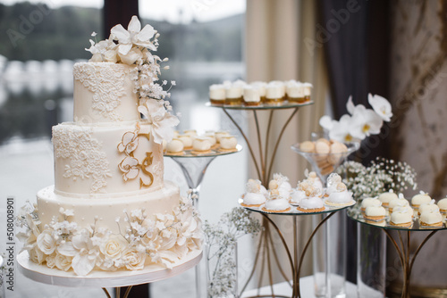 Multilevel wedding cake decorated with colorful flower