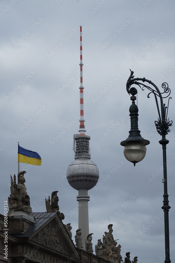 Berliner TV-tower with lantern and Ukrainian flag, vertical Berliner TV-tower with lantern and Ukrainian flag, vertical