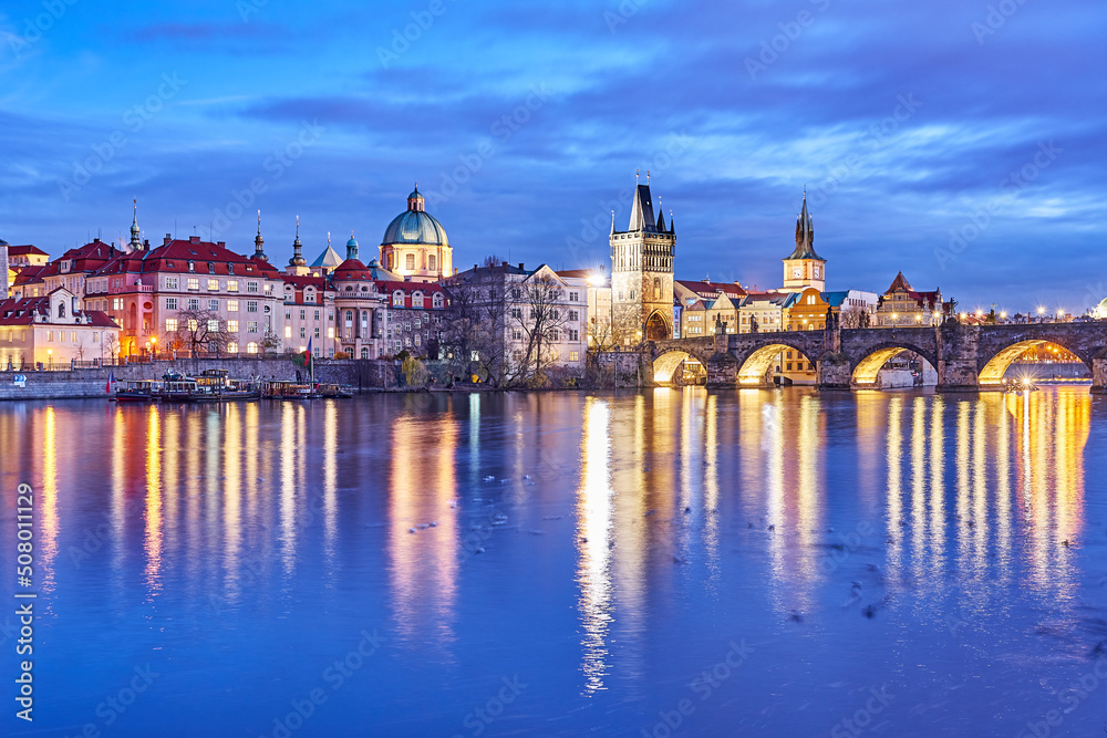 View across the Vltava river on the Charles Brdige and the Old Town Bridge Tower in Prague, Czech Republic