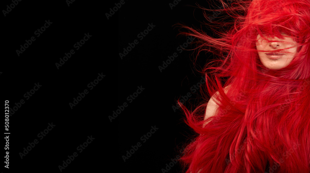 Dyed hair care and fashion concept. Fashion model girl with windswept long dyed red hair Dyed hair care and fashion concept. Fashion model girl with windswept long dyed red hair