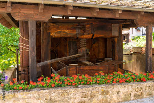 traditional wine press in the historic village center of Mittelbergheim photo