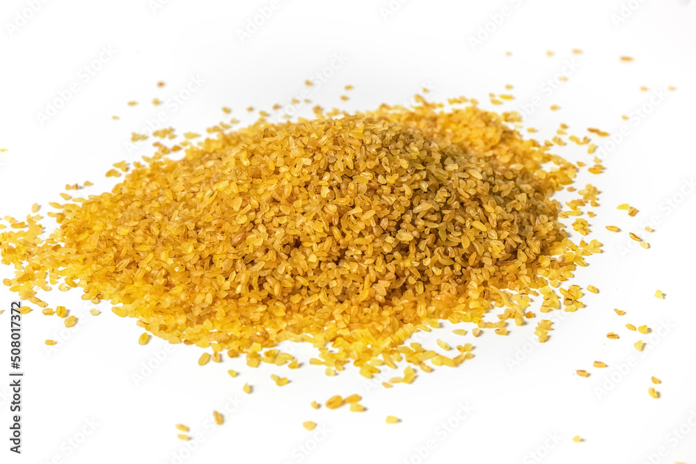 Groats Bulgur on a white background. Healthy food. Photo Groats Bulgur on a white background. Healthy food. Photo