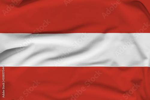 Austria national flag, folds and hard shadows on the canvas