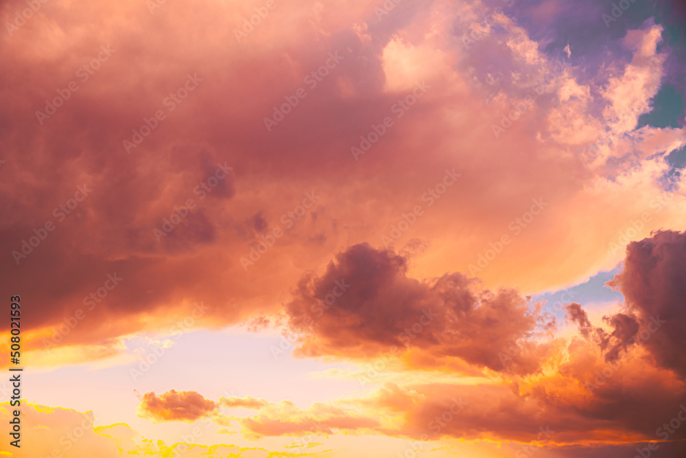 Amazing natural bright dramatic sky in different colours during sunset sunrise time. Colorful sky background. Beauty in nature. Sunset sky natural abstract background in pink purple yellow orange