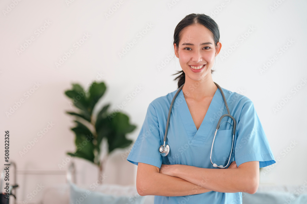Portrait of a young female caregiver at patient home. Portrait of a young female caregiver at patient home.