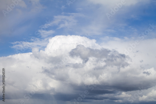 Blue sky with cumulonimbus clouds. View from the ground. © wasnoch