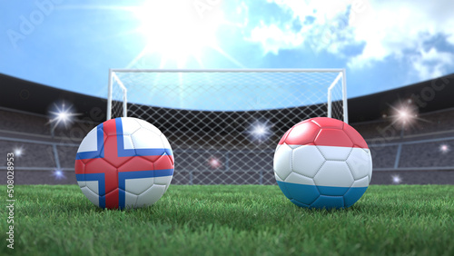 Two soccer balls in flags colors on stadium blurred background. Faroe Islands and Luxembourg. 3d image