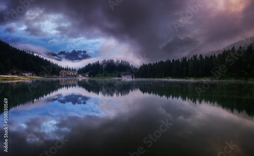 Morning reflections in the Dolomites lake. 