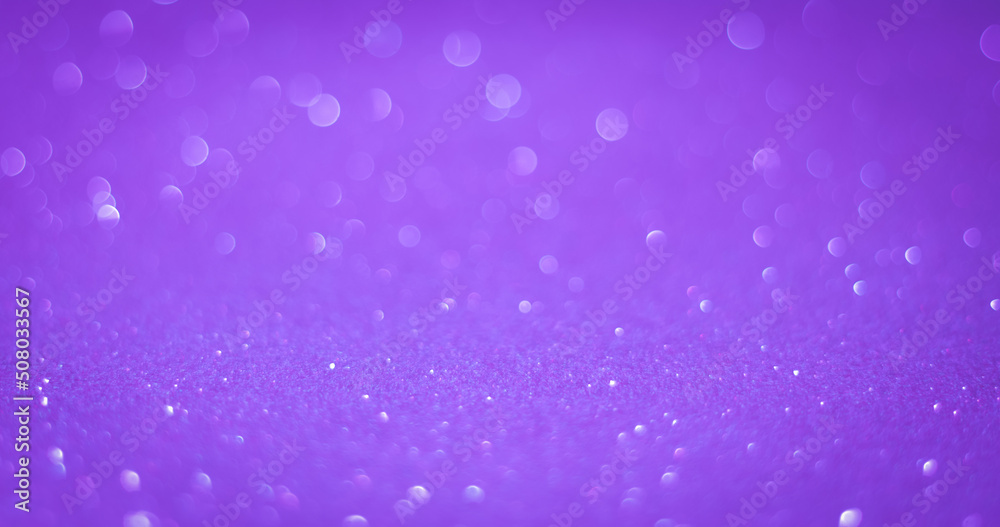 background of abstract purple glitter lights. defocused