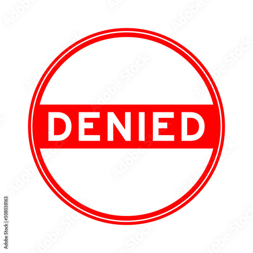 Red color round seal sticker in word denied on white background