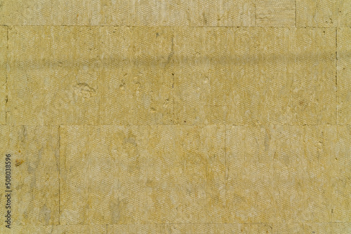 Layer of thermal insulation on the wall of the house outside. Mineral wool panels.