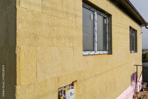 Tablou pe pânză Layer of thermal insulation on the wall of the house outside