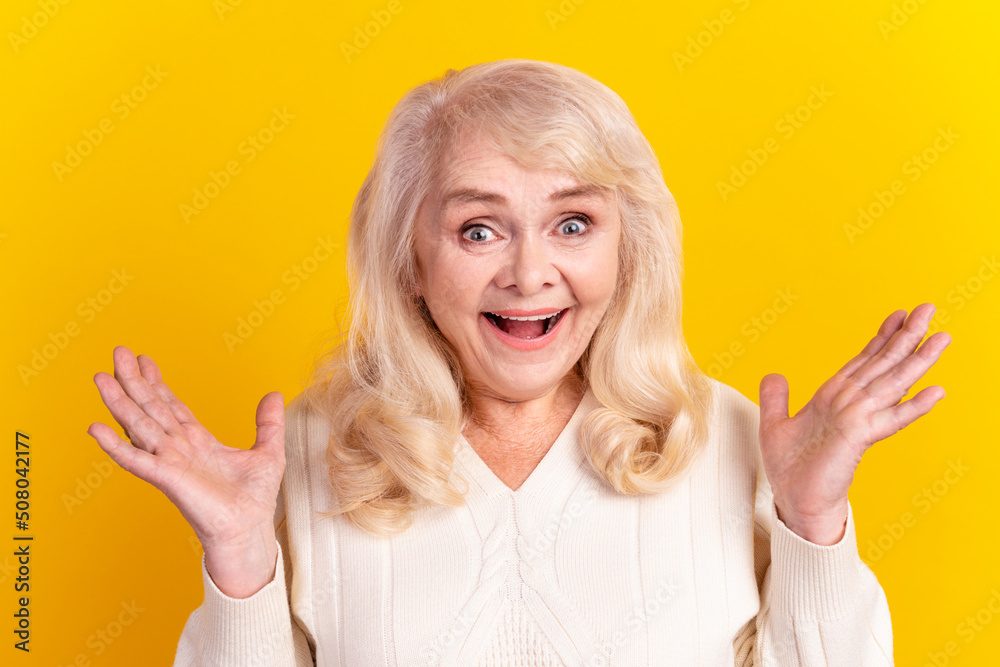 Photo of excited woman face reaction discount good information isolated over yellow color background Photo of excited woman face reaction discount good information isolated over yellow color background