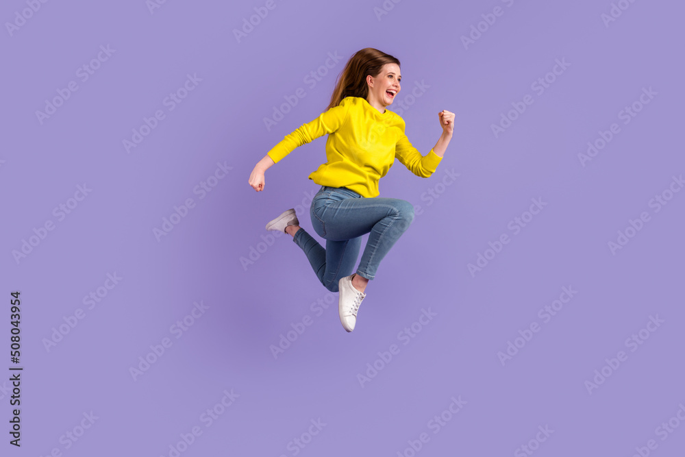 Full length profile side photo of young woman run jump rush look empty space isolated over purple color background
