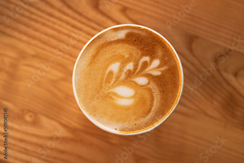 Top view of coffee cup with foam art