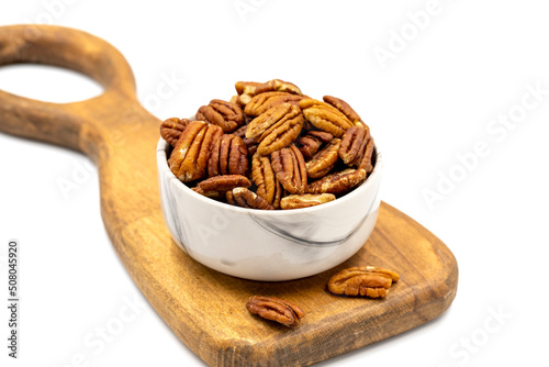 Pecan walnuts on white background. close up