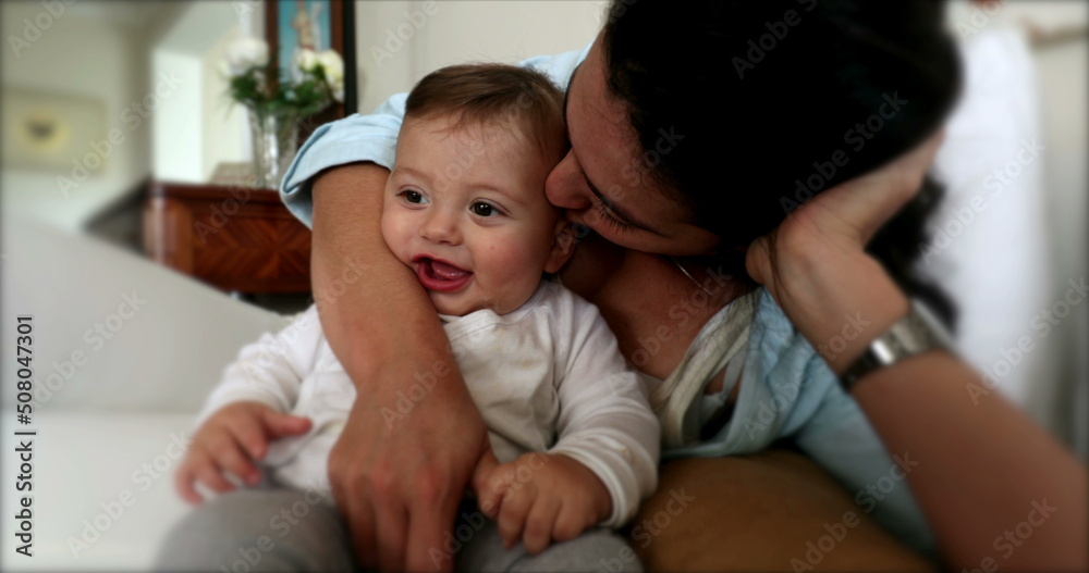 Casual moment of baby and mother together in living-room Casual moment of baby and mother together in living-room