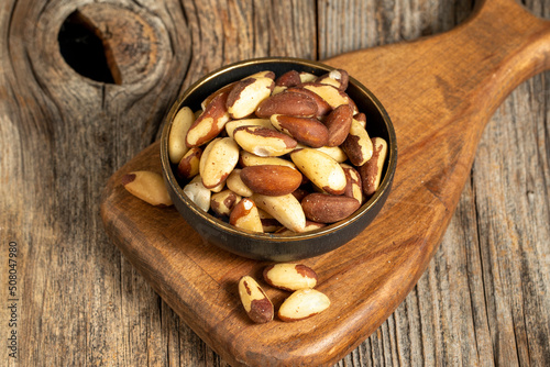 Brazil walnut on wooden background. Close-up brazil walnut kernel