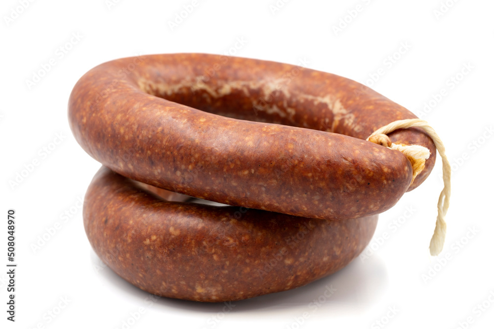 Sausage on a white background. Close-up spicy Turkish sausage Sausage on a white background. Close-up spicy Turkish sausage
