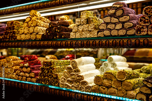 Traditional Turkish delights sweet rolls, Oriental sweets lukum, lokum, nougat.