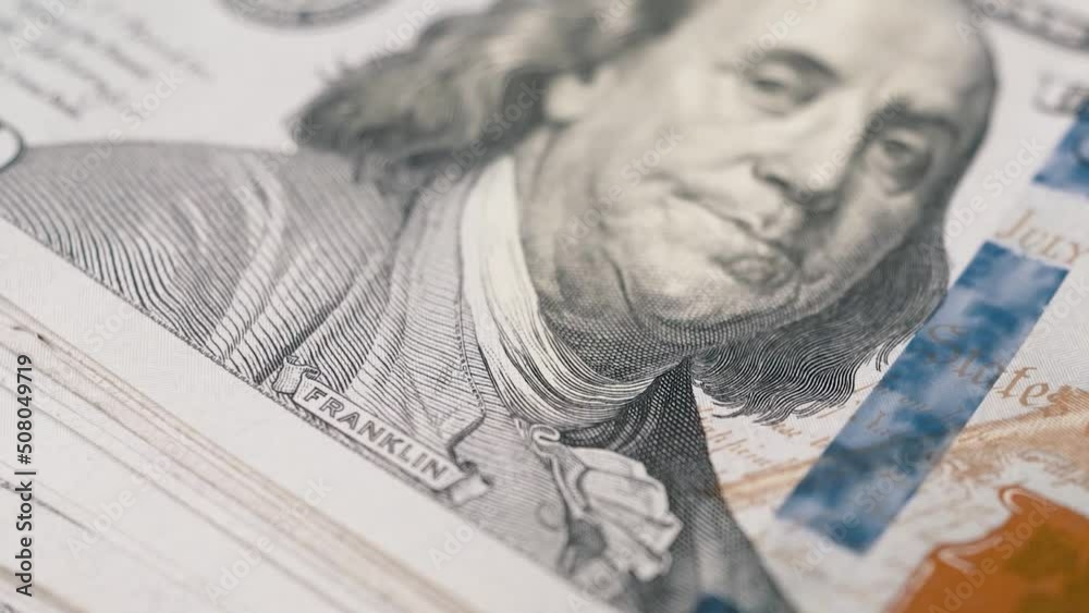 100 dollar bills macro panning shot showing president franklin print