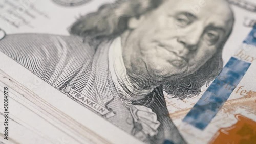 100 dollar bills macro panning shot showing president franklin print