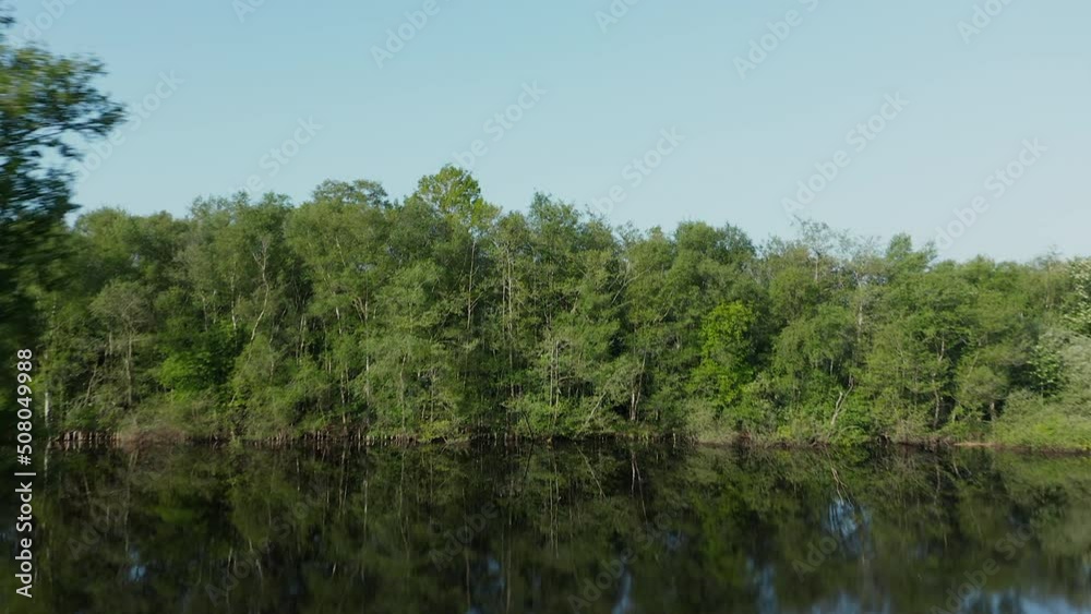 Drone Flying Over Placid With Dense Vegetation In Ossenzijl, Friesland, Netherlands. Aerial Shot