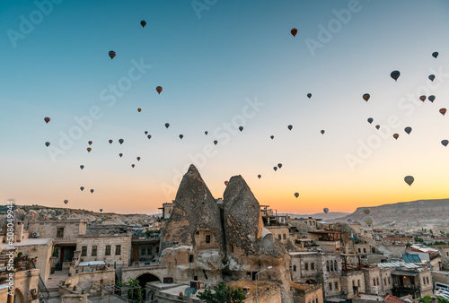hot air balloons over Göreme at sunrise in Cappadocia