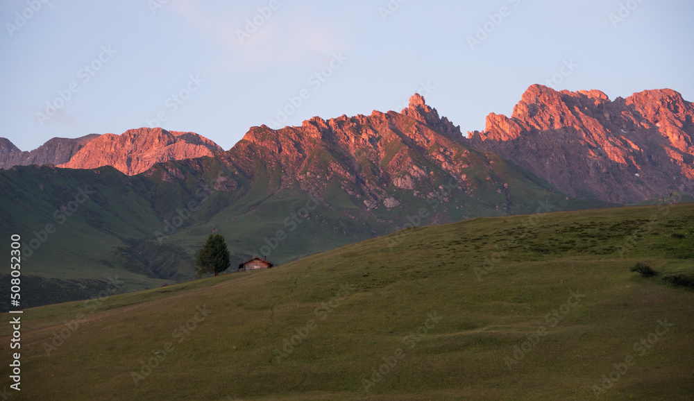 Beautiful sunrise on the meadows of Alpe di Siusi in the Italian Dolomites