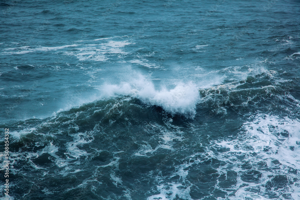 Nature sea abstract background. Foamy waves in the blue ocean Nature sea abstract background. Foamy waves in the blue ocean