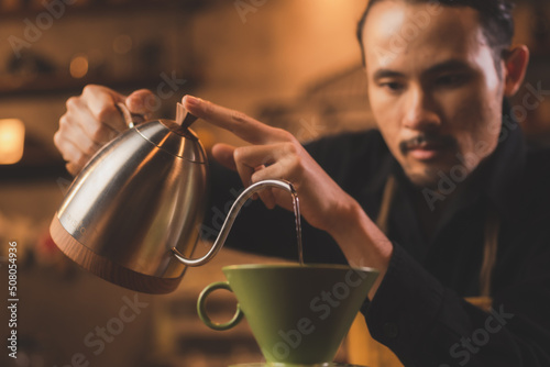 Asian hipster barista worki...