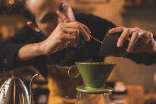 Asian hipster barista worki...