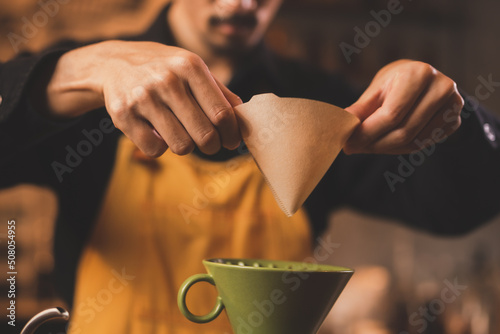 Asian hipster barista worki...