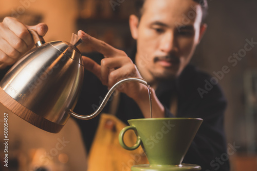 Asian hipster barista worki...