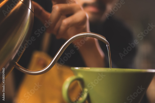 Asian hipster barista worki...