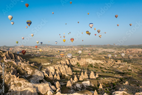 hot air balloons in the morning sky above Cappadocia