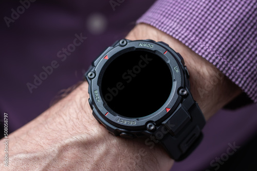 Hand of man wearing trendy smart watch. Modern gadget that lets you always stay connected to internet.