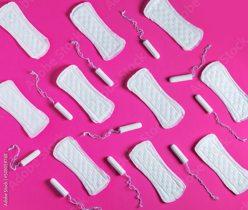 Tampons, feminine sanitary pads pattern on pink background. Hygiene care during critical days. Menstrual cycle.