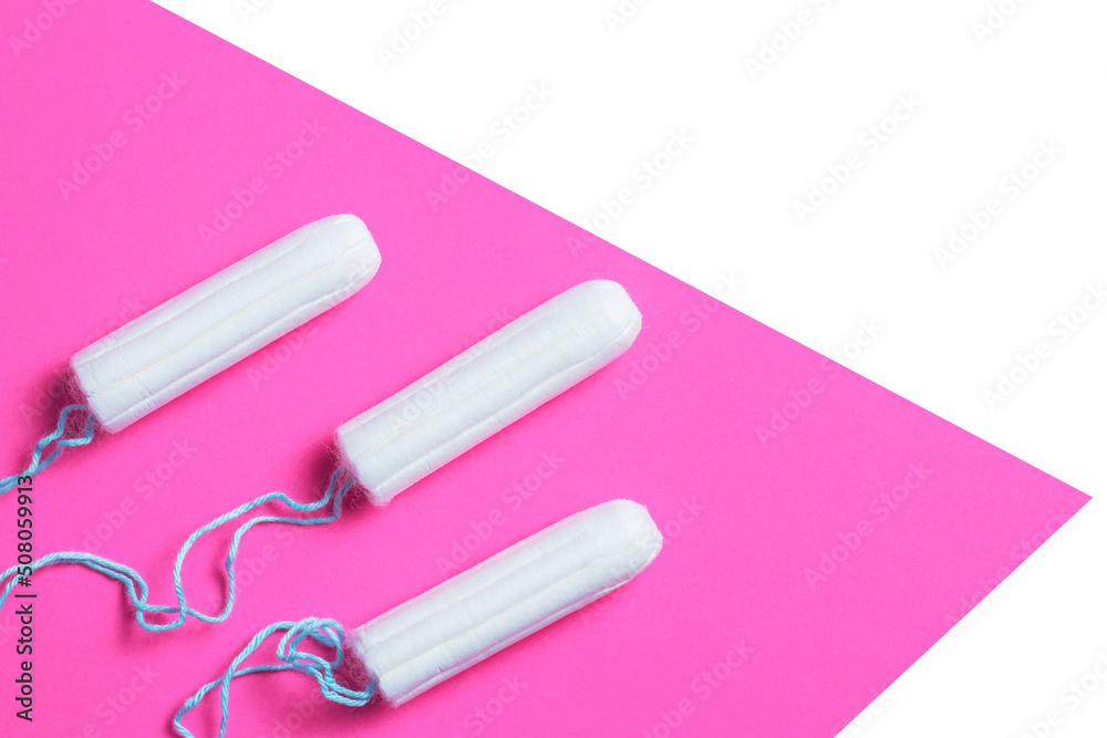 Menstrual period concept. Woman hygiene protection. Cotton tampons on pink background. copy space Menstrual period concept. Woman hygiene protection. Cotton tampons on pink background. copy space