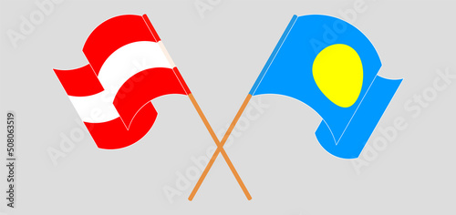 Crossed and waving flags of Austria and Palau