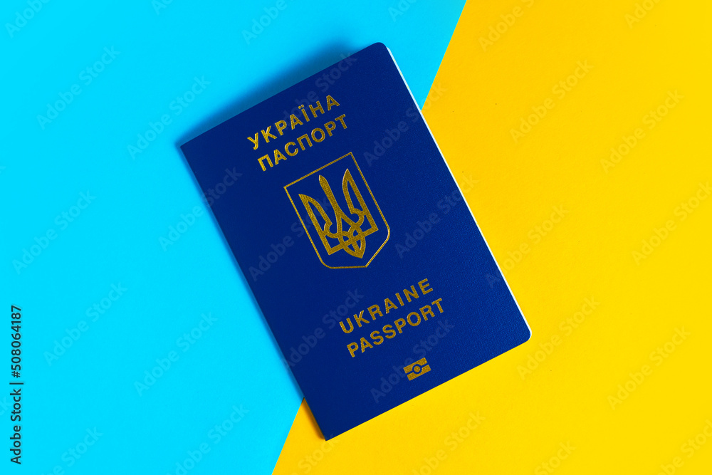 Passports of Ukraine on the background of the Ukrainian flag Passports of Ukraine on the background of the Ukrainian flag