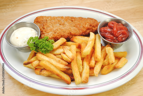 Fish and Chips Dinner Served on a White Plate 