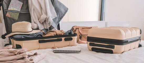 Travel. Staycation.local travel new normal.Girl packing luggage in suitcase and travel documents Travel,tourism,vacation,relocation.Mental health and travel vacation Film grain