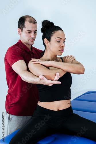 therapist performs a back and lumbar sprain on a woman