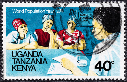 EAST AFRICAN COMMUNITY - CIRCA 1974: A stamp printed in East African Community, is dedicated to World Population Year, is shown Advice on family planning, circa 1974