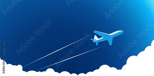 Obraz na płótnie Air plane flies in the blue sky above the clouds, leaving trail behind it