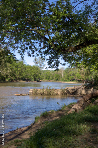 View of a stone jetty on the river front.
