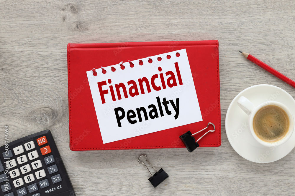 Financial penalty. text on white paper on red notepad