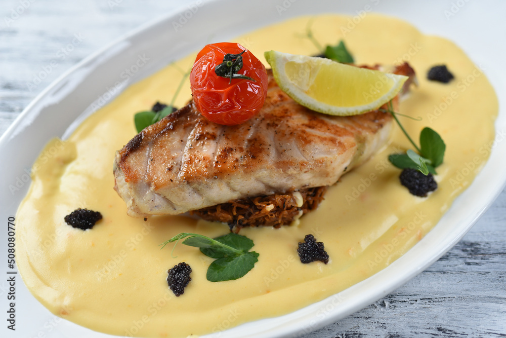 grilled fish fillet with vegetable puree, tomatoes and lemon grilled fish fillet with vegetable puree, tomatoes and lemon
